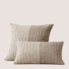 Cushion from the Tile collection in collaboration with British architect John Pawson, featuring rectangular shapes that form a mosaic in three shades of gray inspired by stone, marble, and tile. Cojín de diseño de la colección de John Pawson y Teixidors en lana merina y yak
