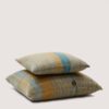 Moodern mid-season cushions in 100% traceable merino wool, in watery and botanical tones, featuring a unique and unrepeatable pattern. Cojín Moodern de lana merina con trazabilidad en tonos verdosos con un patrón irrepetible.