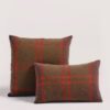 ASPEN cushion cover in Italian cashmere with green and orange checkered pattern. Cojín de cashmere italiano tejido en telar manual de forma exquisita de cuadros en tonos marrones, anaranjados y verdosos