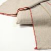 Manta de lana merina Texidors en lana merino con perfil en tono terracotta